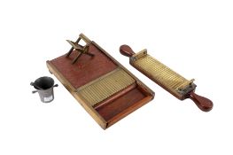 A vintage pharmacist brass bound pill maker, pewter pestle and mortar, etc. Max.