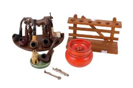 A collection of assorted smoker's pipes with stands, etc. Max.