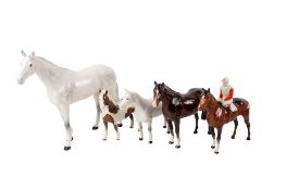 A collection of five assorted Beswick figures modelled as horses. Max.