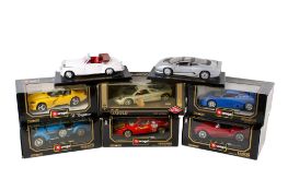 A collection of eight assorted 1:18 scale diecast model cars.