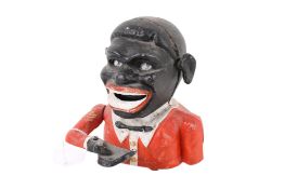 A cast metal and painted mechanical money box.