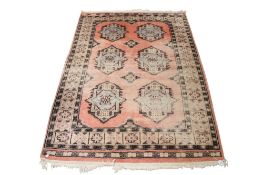 An Al-Malik Pakistani hand knotted rug on a pink ground.