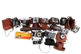 A collection of assorted vintage film cameras. Many in cases and one original box, etc.