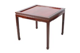 A Chinese hardwood Mahjong games table. Of traditional form raised on square supports.