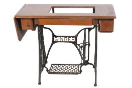 A vintage Singer sewing machine cast iron table base.