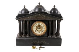 A black slate eight day mantel timepiece.