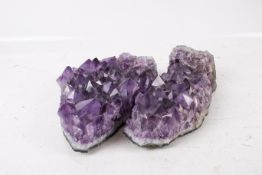 Natural amethyst quartz crystal cluster specimen, broken in two.
