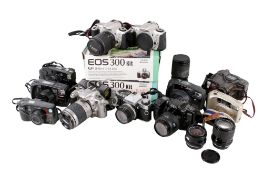 Two suitcases with a collection of assorted vintage 35mm film cameras.