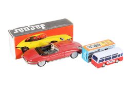 Two vintage friction driven vehicles.