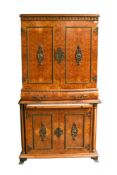 A 20th century two part French style burr walnut cocktail cabinet.