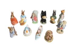 A collection of eleven assorted Beswick Beatrix Potter character figures.