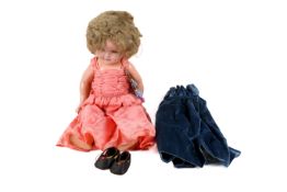 A vintage Shirley Temple composite headed doll by Ideal.