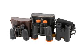 Three pairs of vintage binoculars.