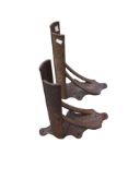 A pair of vintage cast iron horse saddle racks.