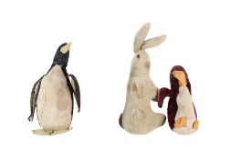 Three vintage soft toys and a bobble-head figure.