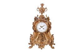 A gilt brass mantel clock.