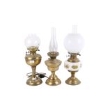 A group of three assorted vintage table lamps.