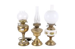 A group of three assorted vintage table lamps.