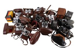 A collection of assorted vintage film cameras.