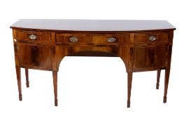 A 20th century Regency style mahogany bow fronted sideboard.