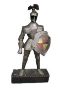Reproduction adult size metal suit of armour.