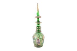 A Bohemian enamelled green glass decanter with gilt decoration.