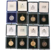 A collection of eight St. George's Hill Golf Club medals, boxed.