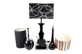 Three assorted contemporary black table lamps. Including 'Daffy 3' and 'Bud', all with shades.
