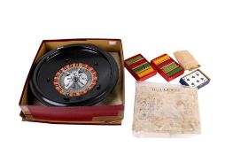A vintage roulette wheel and accessories, boxed.