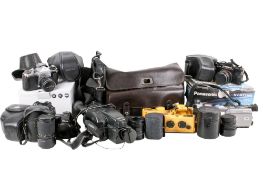 A collection of assorted film and digital cameras with some accessories.