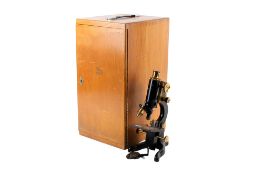 A vintage Watson & Sons Ltd Service microscope, cased. Including some accessories. Max.