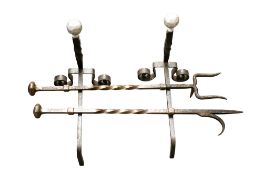 Two sets of fire irons.