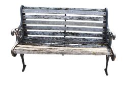 Garden bench with wooden slats and metal ends.