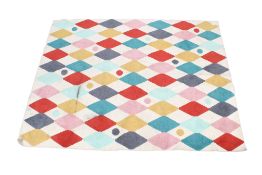 A modern rubber backed wool rug on a cream ground. With colourful geometric design.