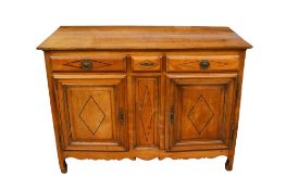 A 19th century French fruitwood sideboard.