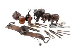 A mixed lot. Including nut crackers, wooden elephants etc. Max.