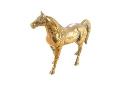 A cast brass figure modelled as a standing horse.