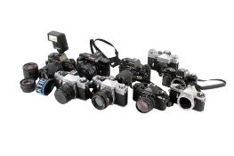 A collection of assorted vintage 35mm film cameras. Including some instruction booklets, etc.