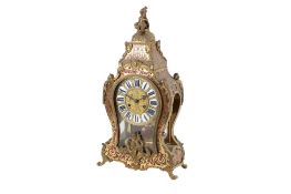 A French Boulle work mantel clock. Eight day movement striking to a bell, engraved brass dial, 'F.