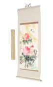 A Chinese scroll painting. Painted with pink peonies and foliage in watercolour on paper.