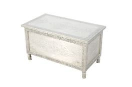 A modern metal covered blanket box.