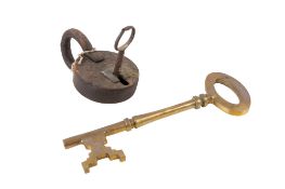 An old iron padlock with a key plus a large brass key. Diameter 12.