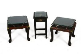 A pair of Chinese side tables plus another.