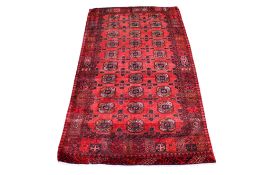A handmade red ground Kurosh, Iran, cyrus rug.