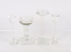 Four Galway Living crystal glass candlesticks. Including a pair raised on circular bases, etc. Max.