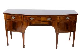 A 20th century Regency style mahogany bow fronted sideboard.