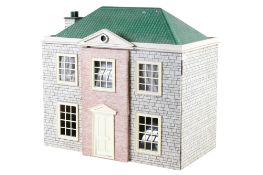 A vintage dolls house and contents.