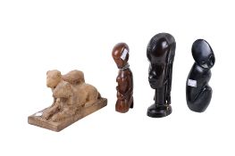 A group of four assorted small sculptures.