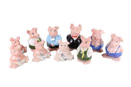 A collection of ten assorted vintage Wade Natwest piggy money banks. Max. H18.