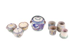 A collection of eight assorted pieces of Poole Pottery.